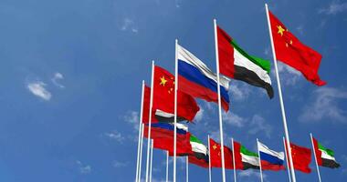 United Arab Emirates, China and Russia Flags Waving Together in the Sky, Seamless Loop in Wind, Space on Left Side for Design or Information, 3D Rendering video