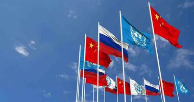 United Nations, UN, China and Russia Flags Waving Together in the Sky, Seamless Loop in Wind, Space on Left Side for Design or Information, 3D Rendering video