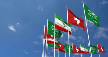 Switzerland, Iran and KSA, Kingdom of Saudi Arabia Flags Waving Together in the Sky, Seamless Loop in Wind, Space on Left Side for Design or Information, 3D Rendering video