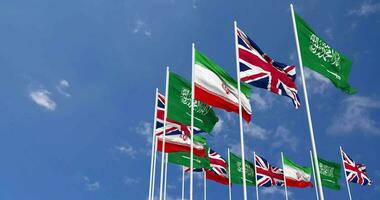 United Kingdom, Iran and KSA, Kingdom of Saudi Arabia Flags Waving Together in the Sky, Seamless Loop in Wind, Space on Left Side for Design or Information, 3D Rendering video