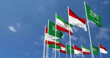 Indonesia, Iran and KSA, Kingdom of Saudi Arabia Flags Waving Together in the Sky, Seamless Loop in Wind, Space on Left Side for Design or Information, 3D Rendering video