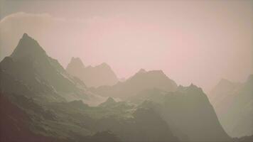 A misty mountain range under a cloudy sky video