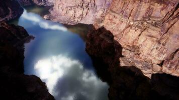 river flowing through a majestic canyon with towering mountains video