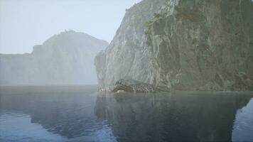 A majestic rock rising from the calm waters video