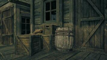 A rustic wooden building with a barrel in the foreground video