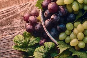 Tasty Grapes on Wooden table photo