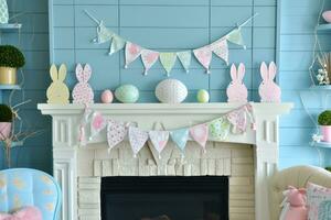 AI generated Pastel Bunny Banners and Egg Accents Adorn Festive Fireplace Display photo