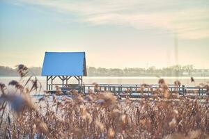 Hut for Bird watching on frozen lake in Hemmelsdorf, northern Germany photo