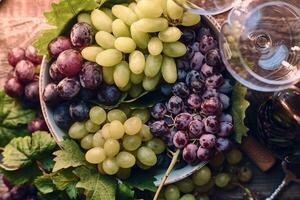 Grapes in a bowl on wooden table photo