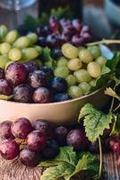 Bowl of delicious grapes photo