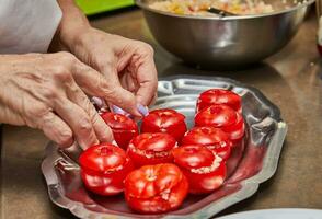 Preparation of Stuffed Tomatoes with Mint Leaves in Home Kitchen photo