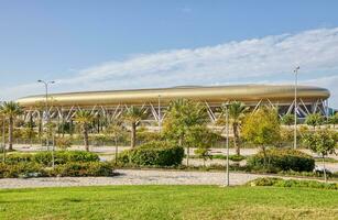 Scenic View of Sammy Offer Stadium Surrounded by Lush Green Grass and Trees in Haifa photo