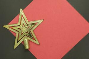 Christmas star on a red and black background with copy space for text photo