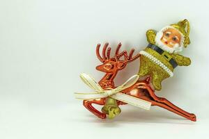 Christmas decoration with Santa Claus and reindeer on white background with copy space photo