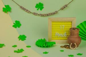 St. Patrick's Day lettering with objects and decorations photo