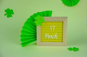 St. Patrick's Day holiday concept, date and clover on background. High quality photo
