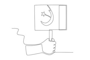 A person's right-hand holds the Pakistani flag tightly vector