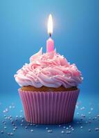 AI generated a pink birthday cupcake with candles is on a blue background photo