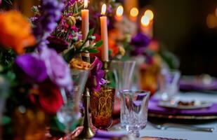 AI generated colorful wedding table settings with candles photo