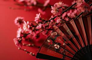 AI generated a paper fan with pink flowers on a red background, photo