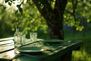 AI generated a green table with plates, glasses and a tree in the background photo