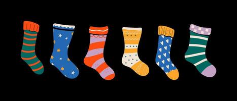 Set of colorful socks with delightful patterns and textures. Vector illustrations.