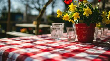 ai generado rojo y blanco guingán mesa cubrir en el mesa en primavera foto