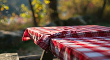 AI generated red cloth picnic tablecloth on the picnic table in autumn nature background photo