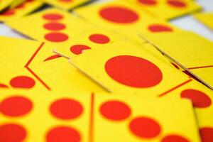 dominoes playing cards isolated white background, yellow red dominoes cards photo