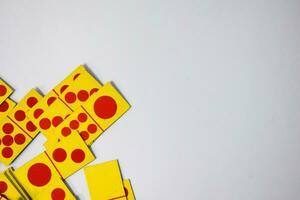 dominoes playing cards isolated white background, yellow red dominoes cards photo