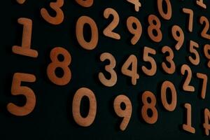 Numbers on a dark background. Seamless pattern. Toned. photo