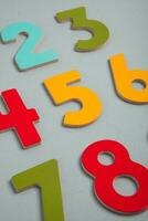 Colorful wooden numbers on black background. Number 1 to 9. photo