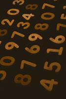 Wooden numbers on a black background. Numbers of different colors. photo