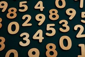 Numbers on a dark background. Seamless pattern. Toned. photo