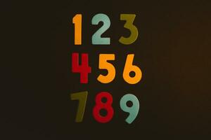 Colorful wooden numbers on black background. Number 1 to 9. photo