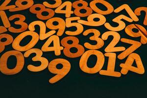 Numbers on a dark background. Seamless pattern. Toned. photo
