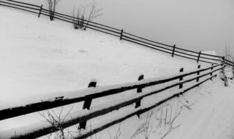 Panorama of the village in the winter mountains covered with snow. Winter landscape. The concept of freedom and solitude. photo