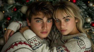 AI generated Young couple embracing in festive sweaters with christmas tree in background photo