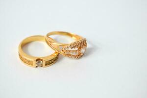 Close Up Golden ring with diamond on isolated white background photo