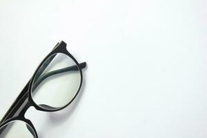 Black frame eyeglasses unisex isolated on white background photo