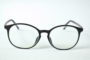 Black frame eyeglasses unisex isolated on white background photo