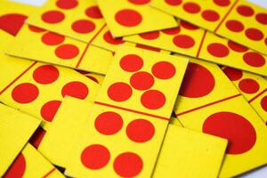 dominoes playing cards isolated white background, yellow red dominoes cards photo