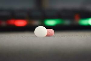close up medical pills on blurred table background photo