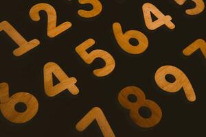 Numbers on a dark background. Seamless pattern. Toned. photo