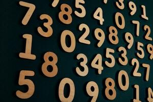 Numbers on a dark background. Seamless pattern. Toned. photo