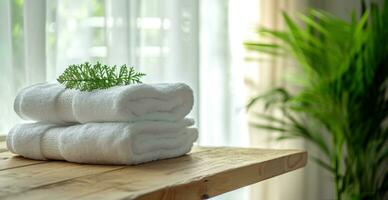 AI generated folded towels on wooden countertop with plant. photo