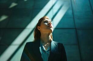 AI generated woman in suit in the office looking up. photo