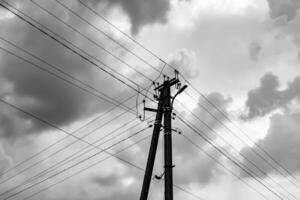 Power electric pole with line wire on light background close up photo