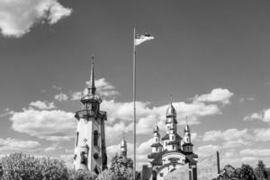 Christian church cross in high steeple tower for prayer photo