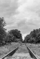 Photography to theme railway track after passing train on railroad photo